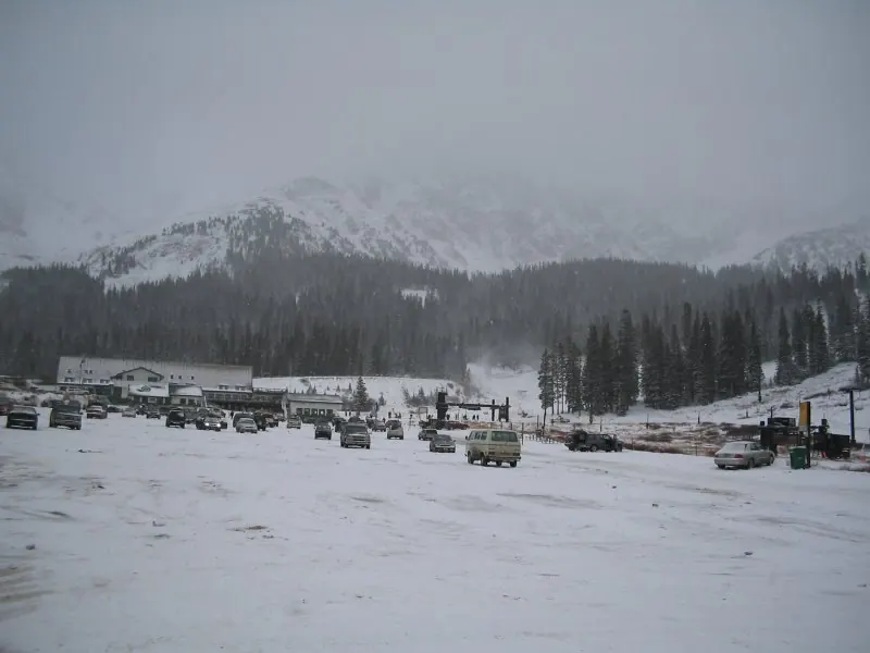 The parking lot at Arapahoe Basin on October 29, 2004 (A-Basin's opening day) at 4:03 PM (local time).  Alas, this is only a thumbnail; I didn't keep the original version. The bottom of the main ski lift is visible.