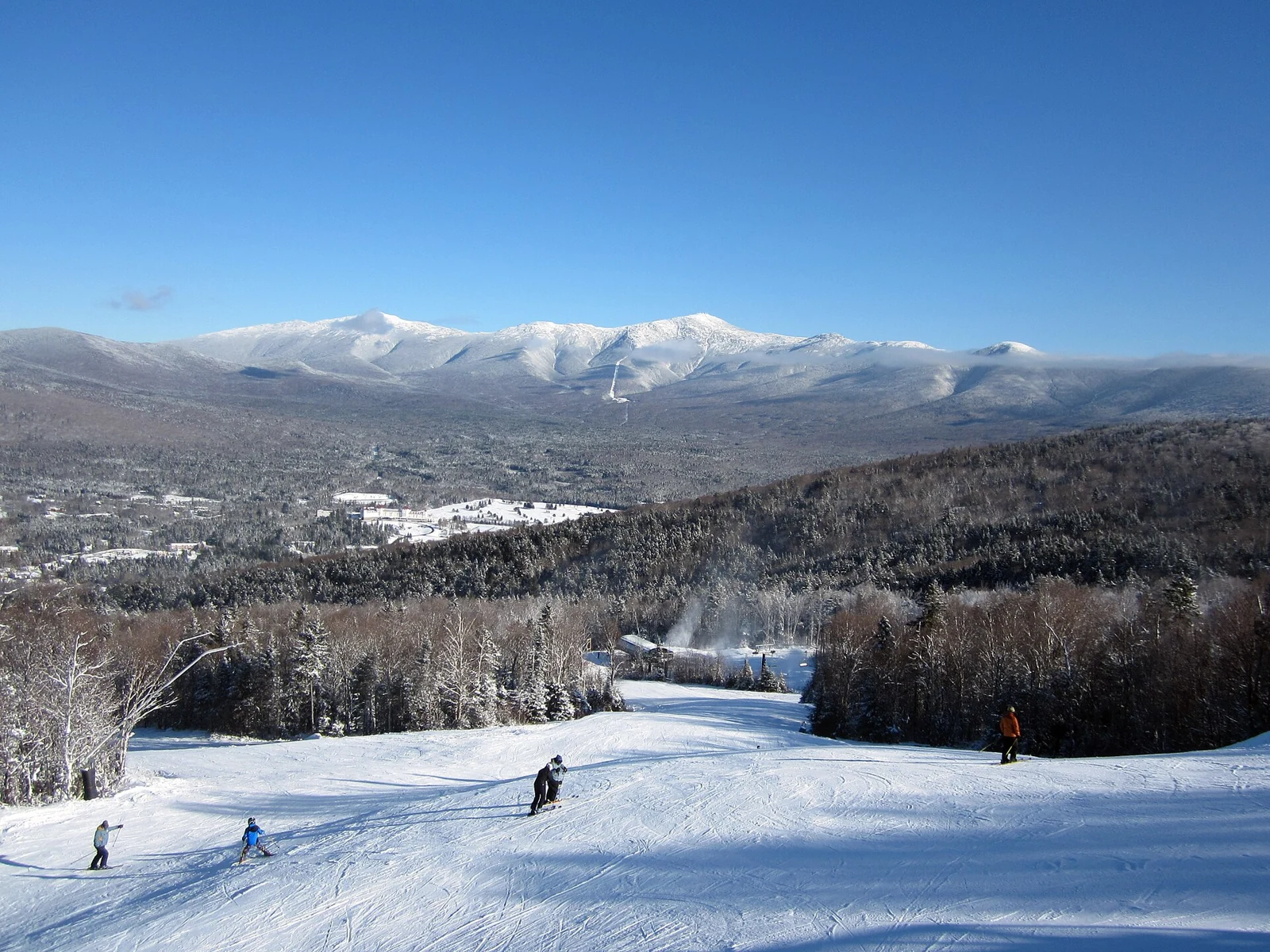 Snowy ski runs with Mount Washington beyond Bretton Woods, New Hampshire.