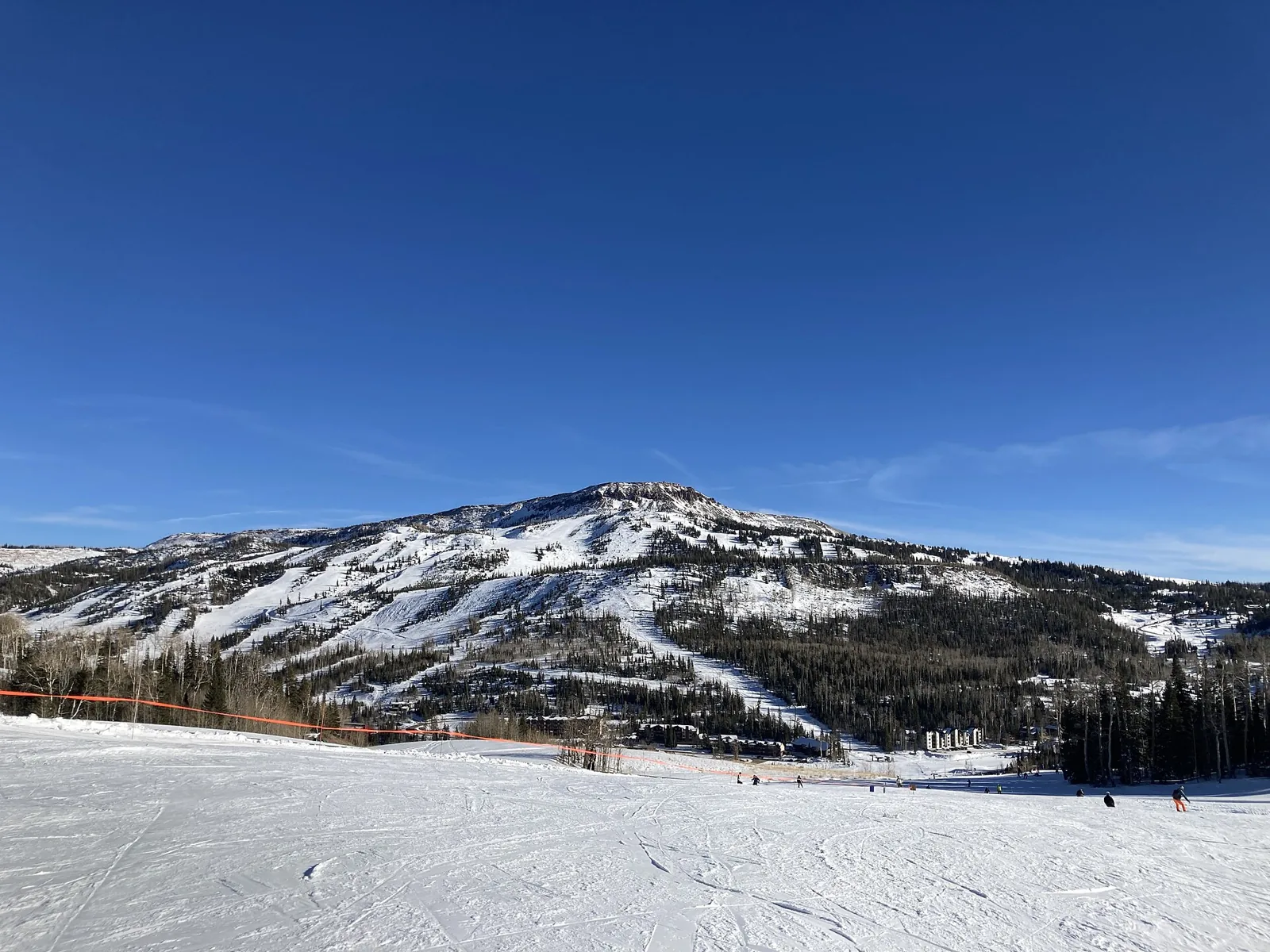 Snow-covered runs and a broad mountain view at Brian Head, Utah.