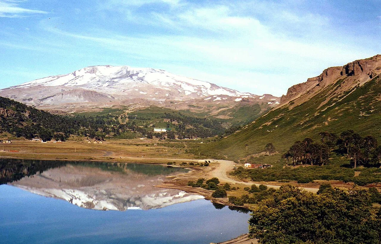 Snow-covered mountain reflected in water near Caviahue, Argentina