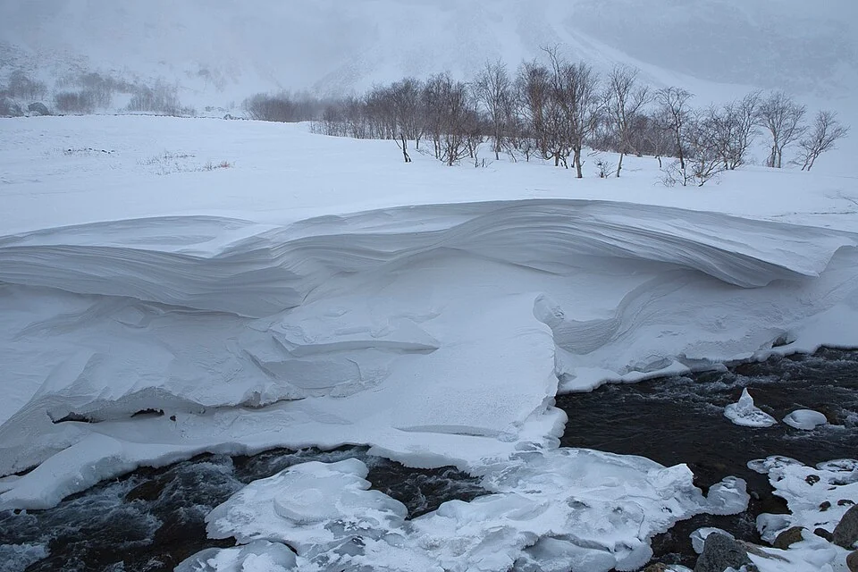 Snowdrifts beside a stream on Changbai Mountain