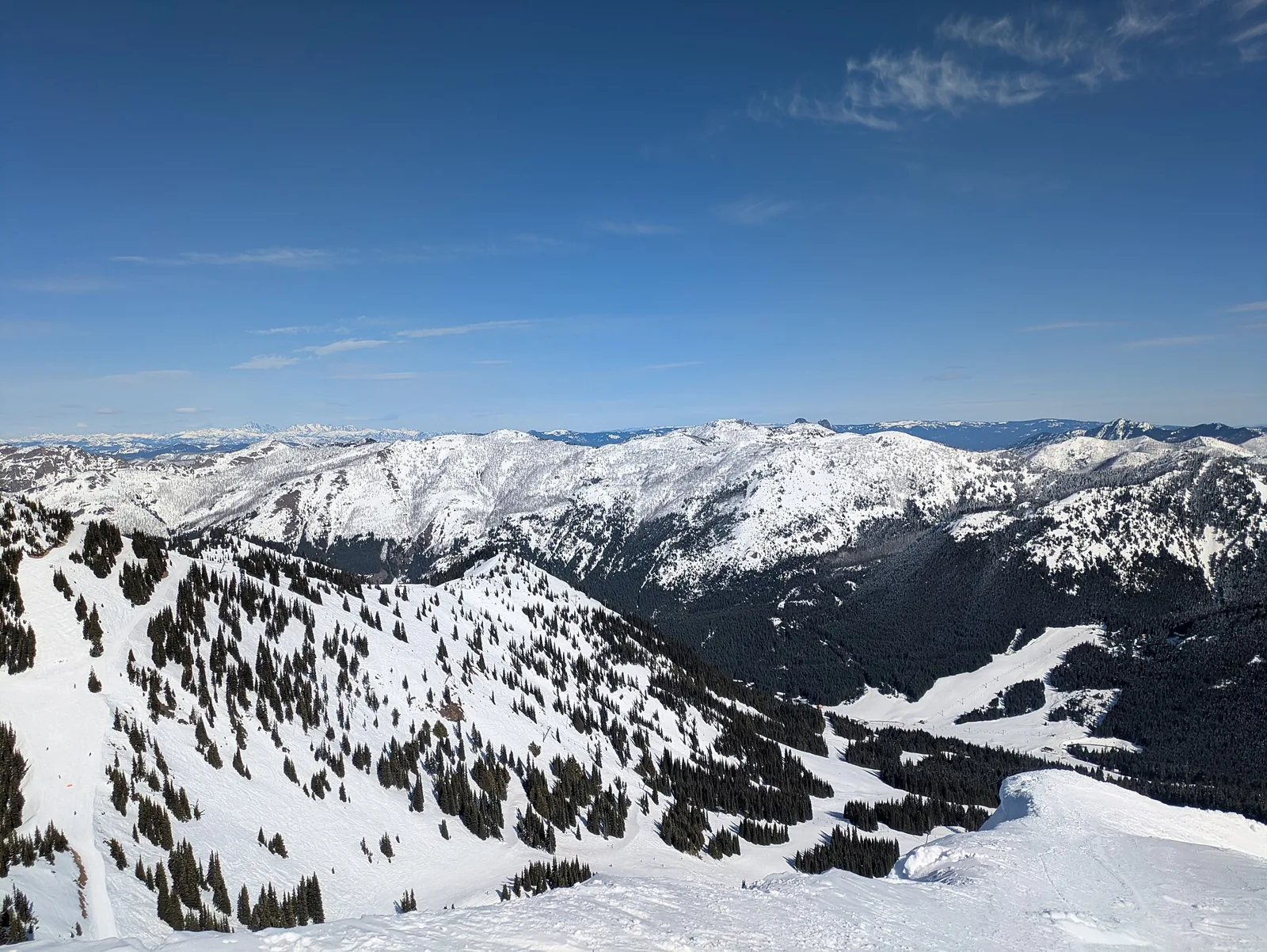 Snow-covered terrain at Crystal Mountain with the Norse Peak massif beyond, Washington.