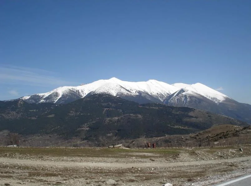 Snow-covered Mount Olympus; KEOAX at Vrysopoules is not shown