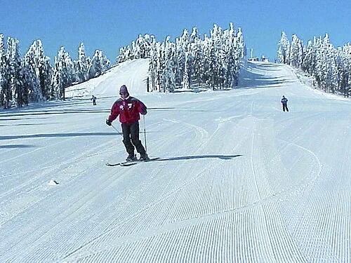 A skier on a groomed run at 49 Degrees North near Chewelah, Washington.
