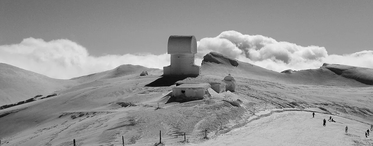 Snowy summit and telescope dome on Mount Helmos near Kalavryta, Greece (wider destination area; not necessarily the ski slopes)