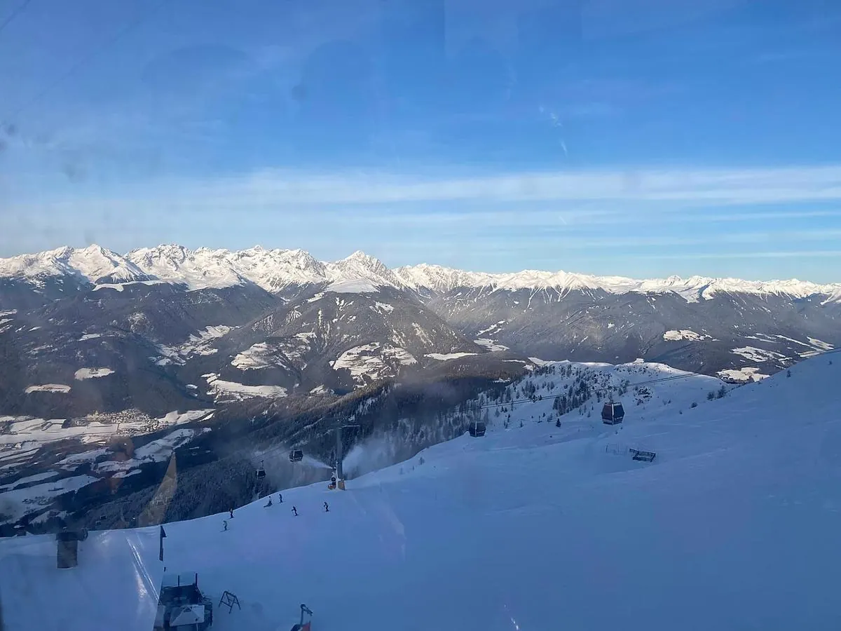 Snow-covered ski slopes and mountain panorama at Kronplatz / Plan de Corones, South Tyrol, Italy