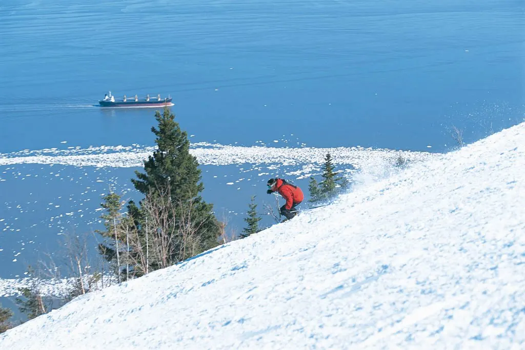 Skiing above the Saint Lawrence River near Petite-Rivière-Saint-François, Quebec, Canada (wider destination area; not necessarily the ski slopes)