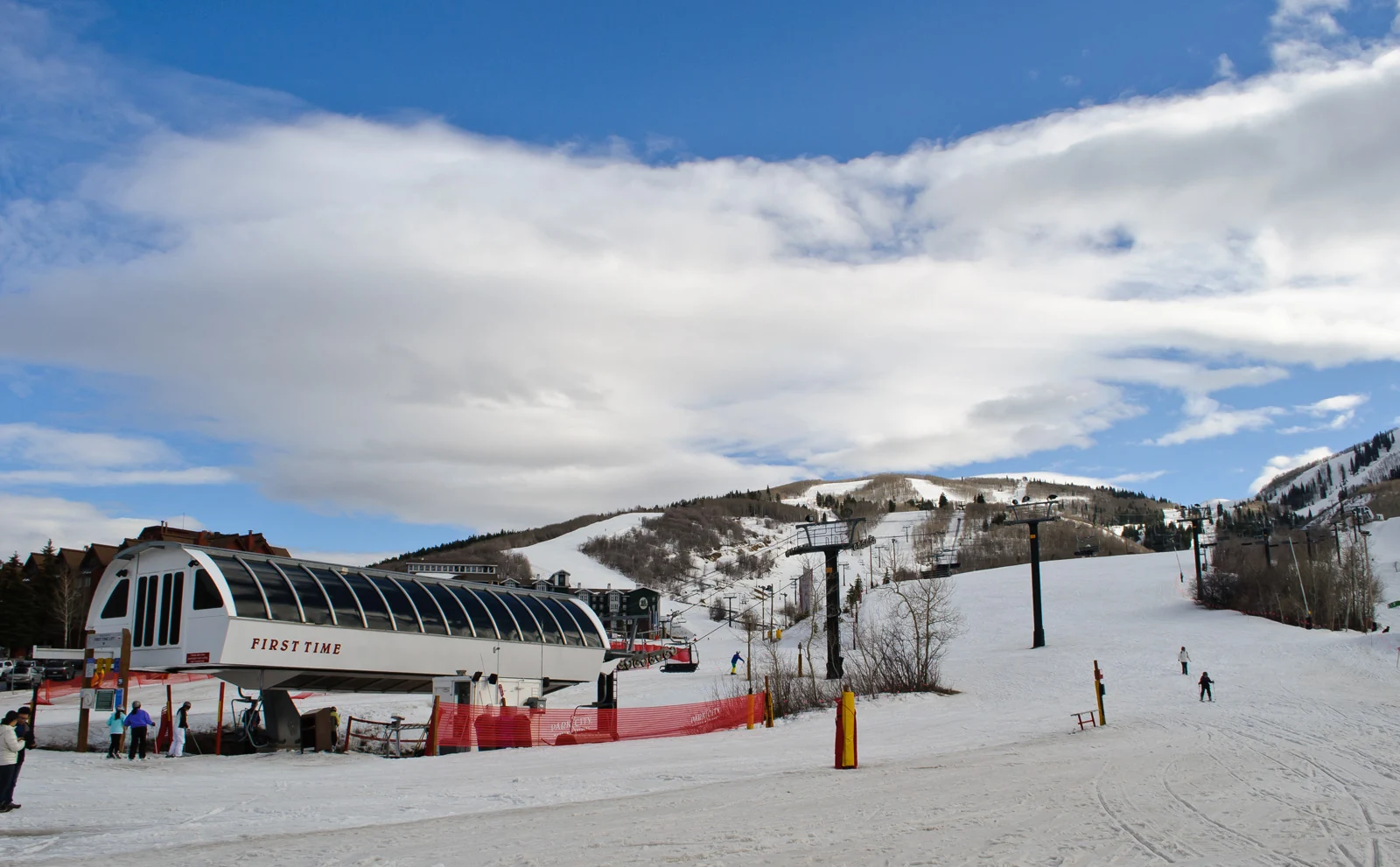 Chairlift base and snow-covered slopes at Park City Mountain, Utah.