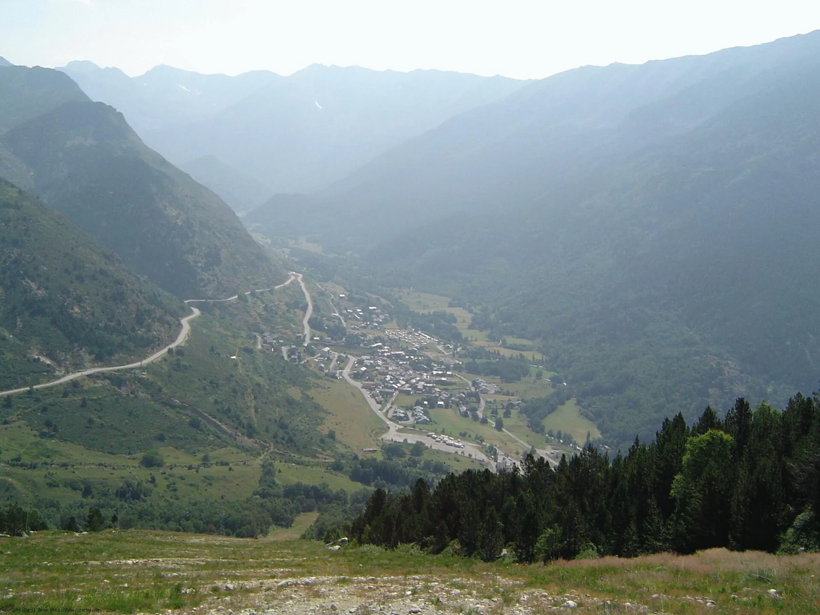 Porté-Puymorens village in a green mountain valley.
