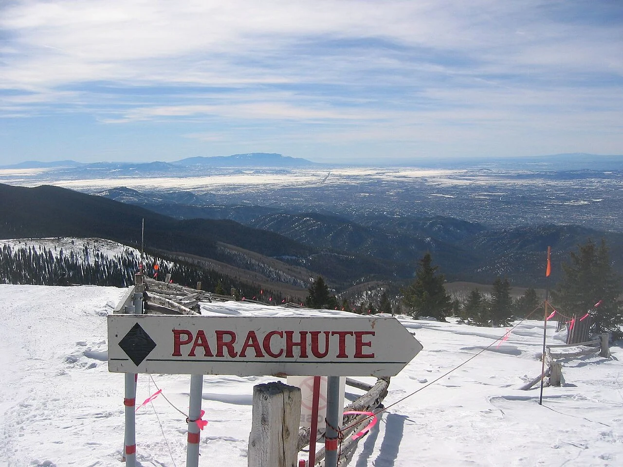 The Parachute ski run and a wide mountain view at Ski Santa Fe, New Mexico.