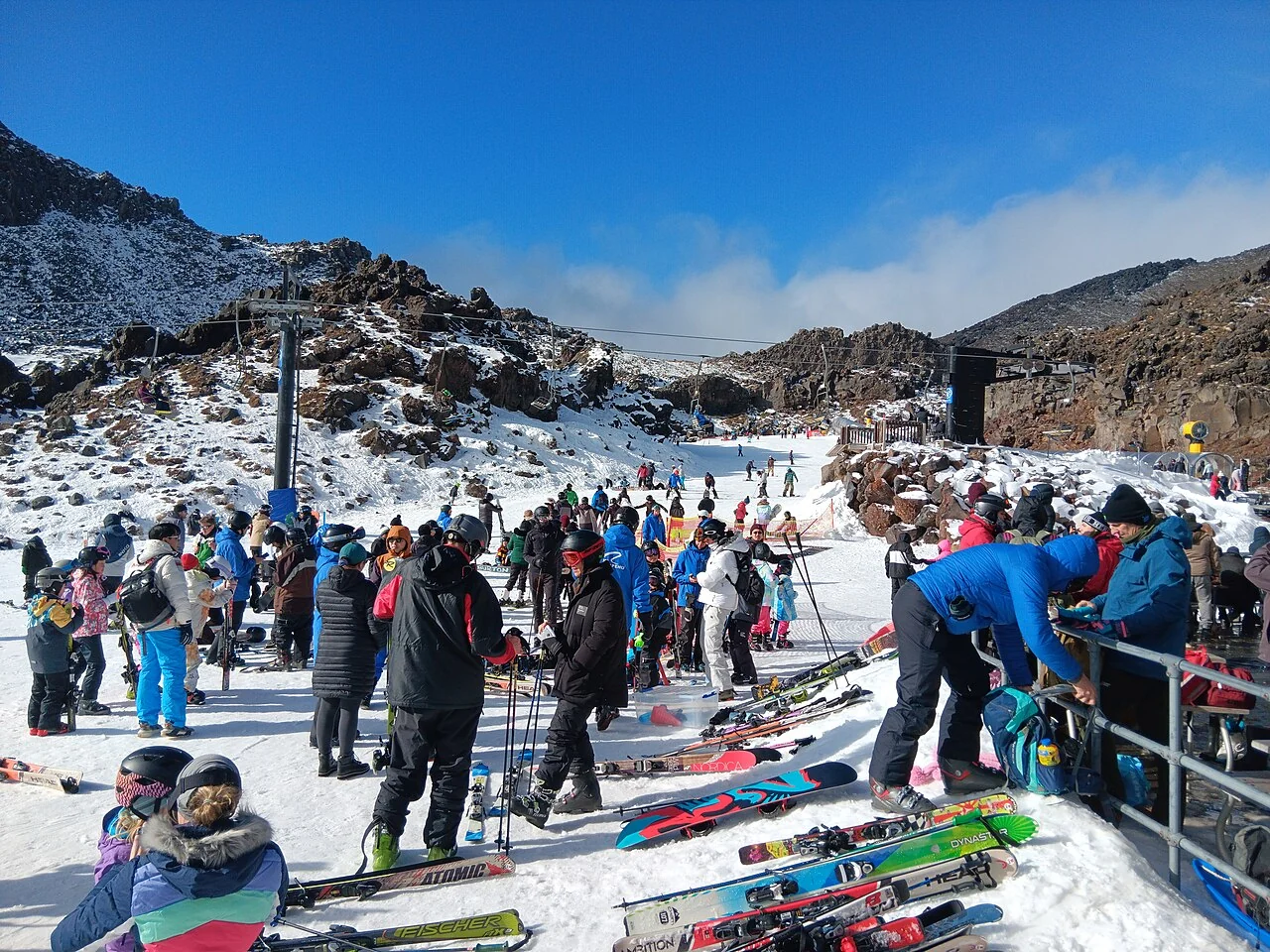 Skiers gathered beside the snow at Whakapapa ski field